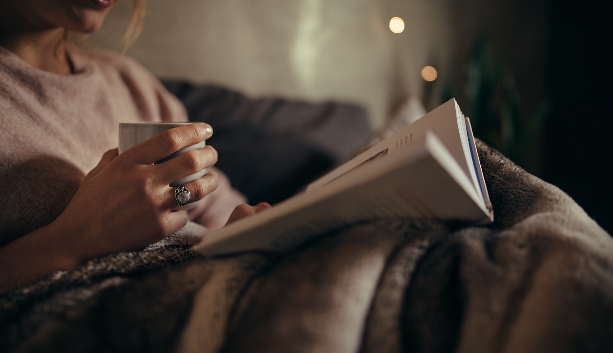 Woman reading in bed