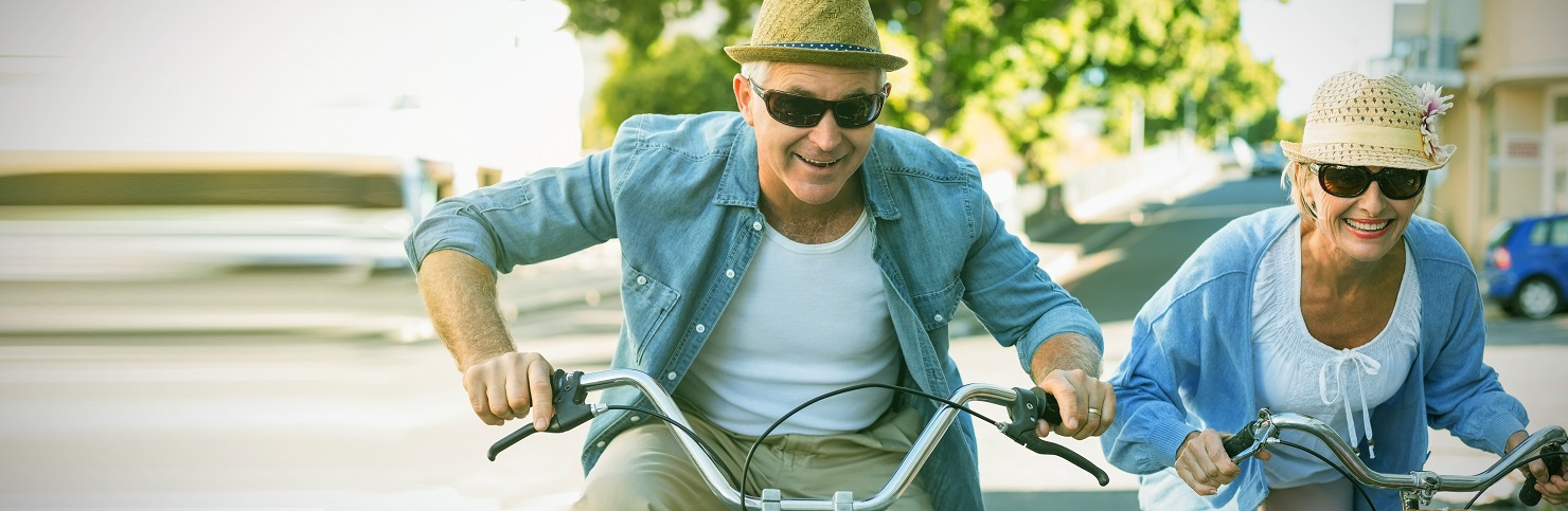 Mature couple riding bicycles