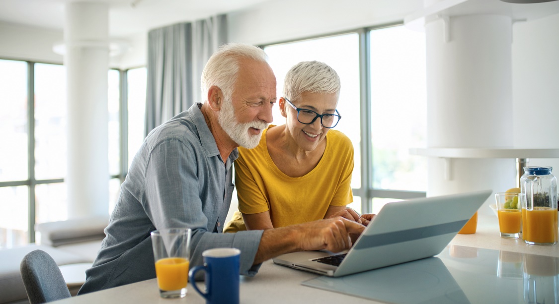 Couple looking at laptop