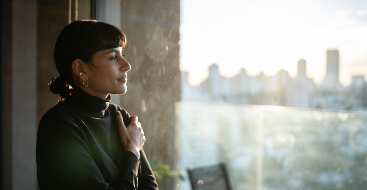 Woman looking out the window