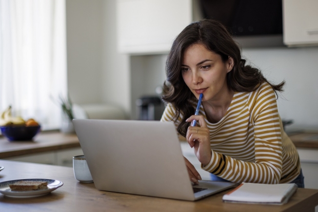 Woman looking at her laptop