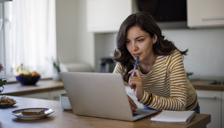 Woman looking at her laptop